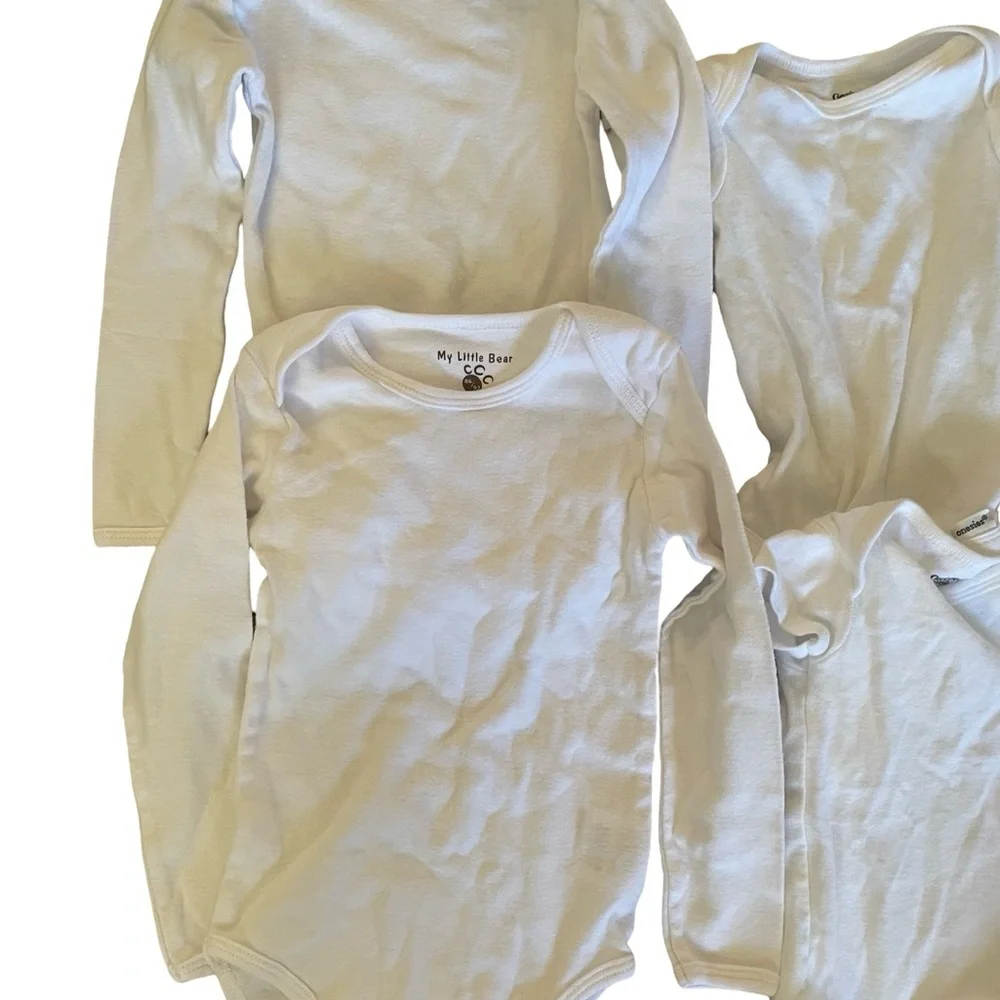 Bundle of 11 white onesies 3-6M